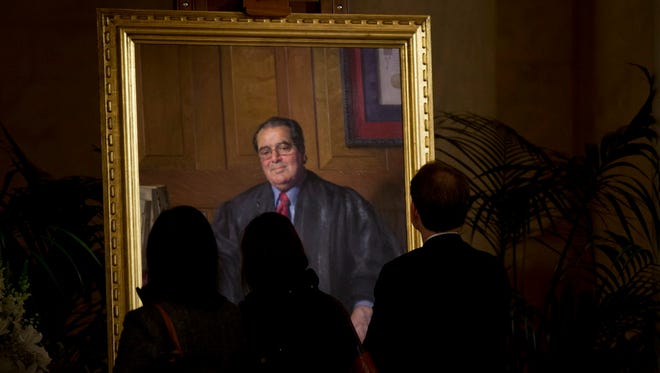 People pay respect to the late Justice Antonin Scalia at the Supreme Court on Feb. 19, 2016.