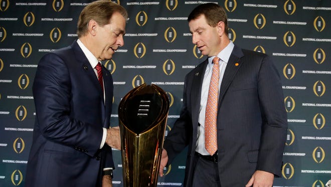 Clemson head coach Dabo Swinney and Alabama head coach Nick Saban shake hands after a news conference for the NCAA college football playoff championship game Sunday, Jan. 10, 2016, in Glendale, Ariz. (AP Photo/Chris Carlson)