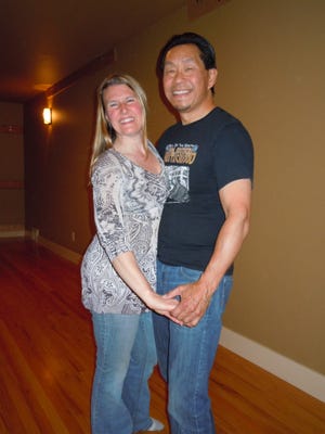 Jennifer with dance instructor Kevin Kim of Confident Blues Dance at her dance lesson Tuesday night
