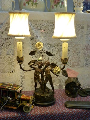 A 1920s metal cherubs twin lamp and toy wind-up jalopy are the types of items people will be able to find Feb. 10 and 11 at the Wausau Antique Show at the Greenheck Field House in Weston.