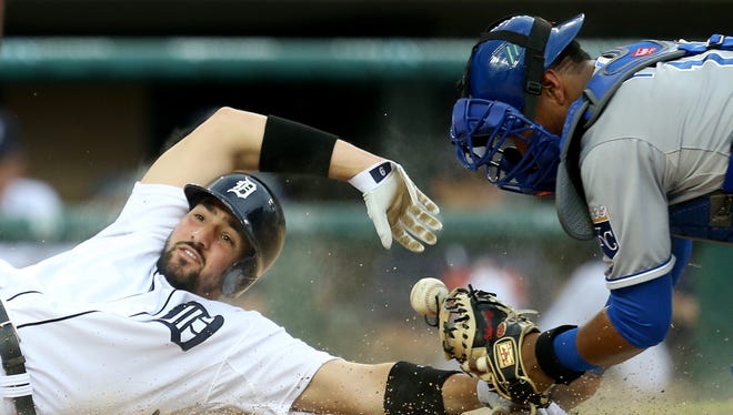 Tigers third baseman Nick Castellanos slides into home safe ahead of the tag attempt by Royals catcher Salvador Perez during the second inning on May 8 at Comerica Park.