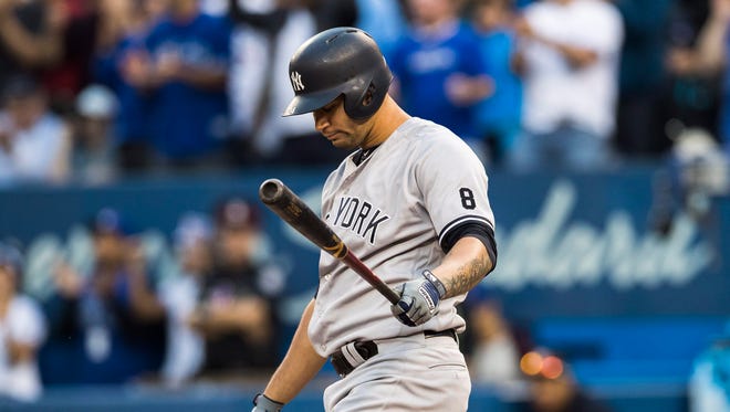 New York Yankees' Gary Sanchez reacts during his at-bat against the Toronto Blue Jays during the eighth inning of a baseball game in Toronto, Saturday, Sept. 24, 2016.