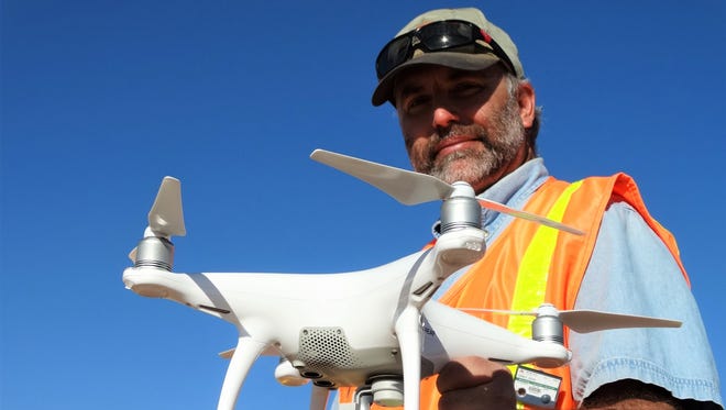 Don Gray (Gordon Environmental/PSC) holds a camera-equipped drone used to produce very detailed aerial images of the new landfill asbestos cell being developed at Corralitos Regional Landfill.