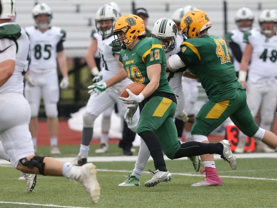Brockport's defensive back Jake O'Connell, 10, runs