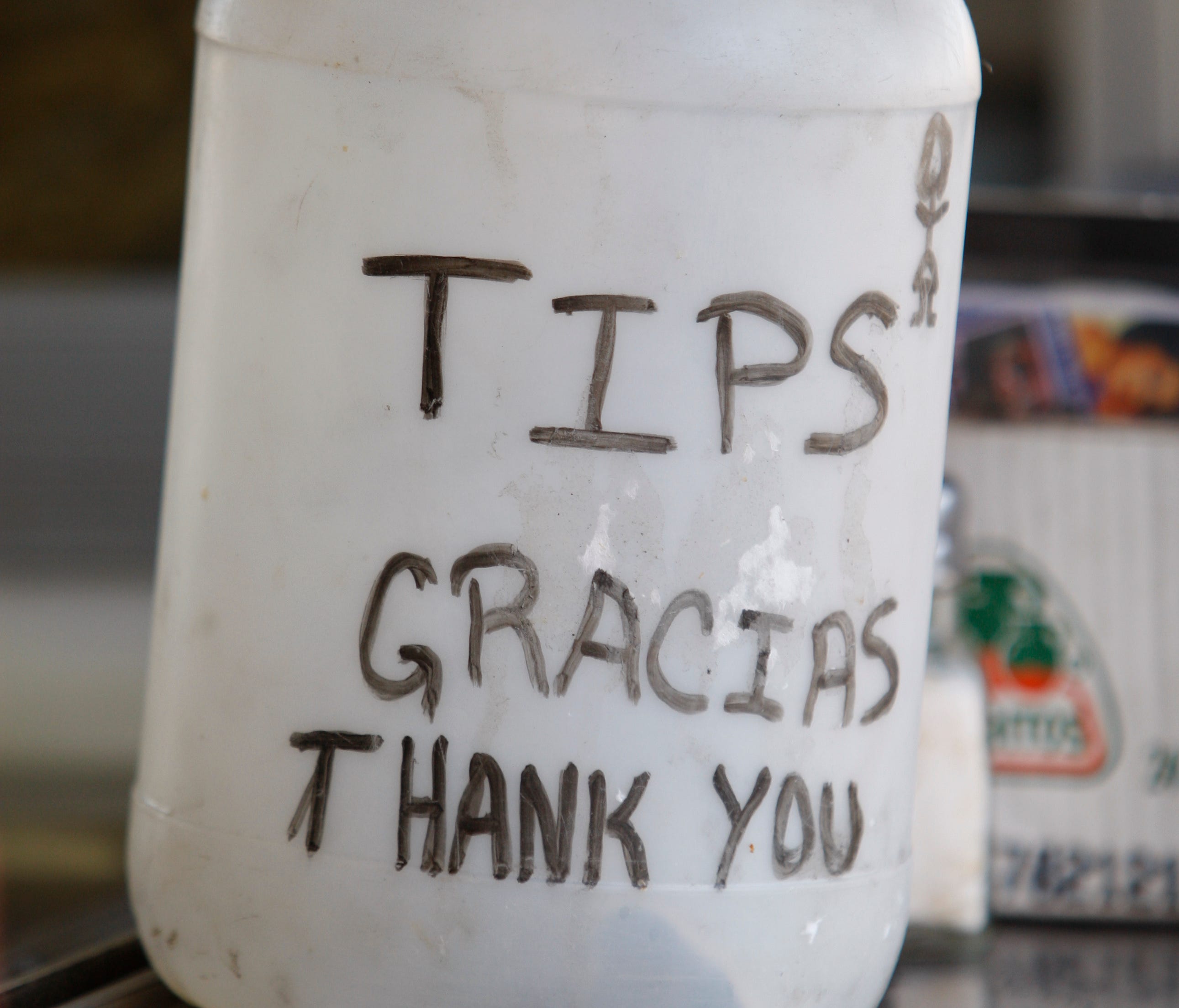 A tip jar at Taqueria Los Poblanos, a taqueria in New Orleans.  There was a recent crackdown on mobile taco stands in nearby Jefferson Parish.  Taqueria Los Poblanos is in Orleans Parish.
