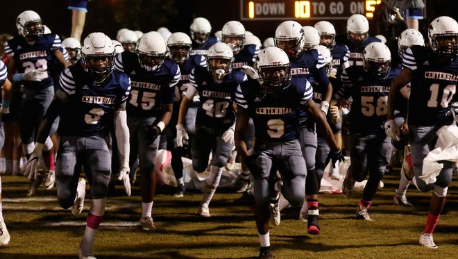 Centennial football players run onto the filed for their homegame against Brentwood Friday October 14, 2016.