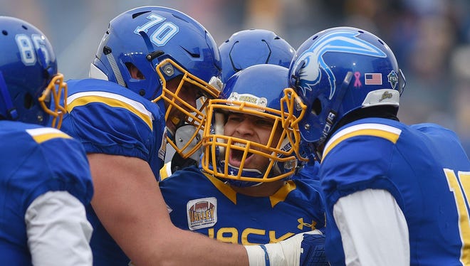 Jacob Brown celebrates with teammates after his first quarter touchdown in SDSU's 33-21 win over North Dakota State.