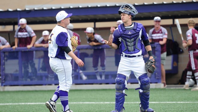 Wylie catcher Caleb Munton (25), right, talks to pitcher Blake Smith (45) during the seventh inning of the Bulldogs' 6-2 win against Brownwood on Friday, April 20, 2018. Smith was nearly perfect on the mound in the win.