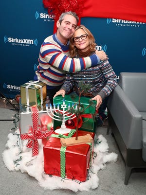 SiriusXM host Andy Cohen poses for photos with Amy Sedaris during  a SiriusXM holiday event on Dec. 14, 2016 in New York.