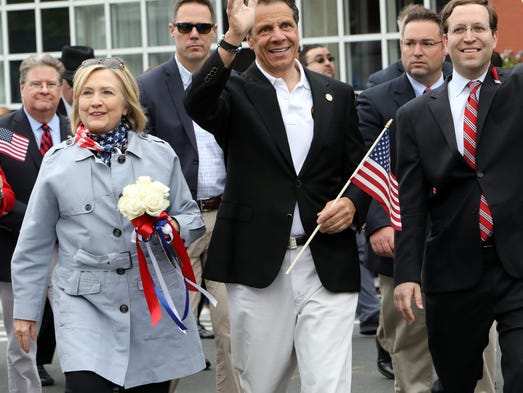 Hillary Clinton and Gov. Andrew Cuomo march in the