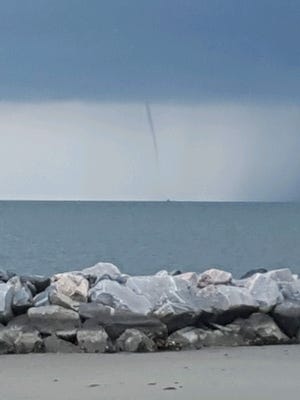 A water spout was spotted off the coast of Cape Charles beach over the Chesapeake Bay on Tuesday, Aug. 2, 2016.