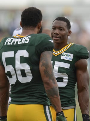 Green Bay Packers linebackers Julius Peppers and Andy Mulumba during training camp practice at Ray Nitschke Field on Friday, Aug. 7, 2015.