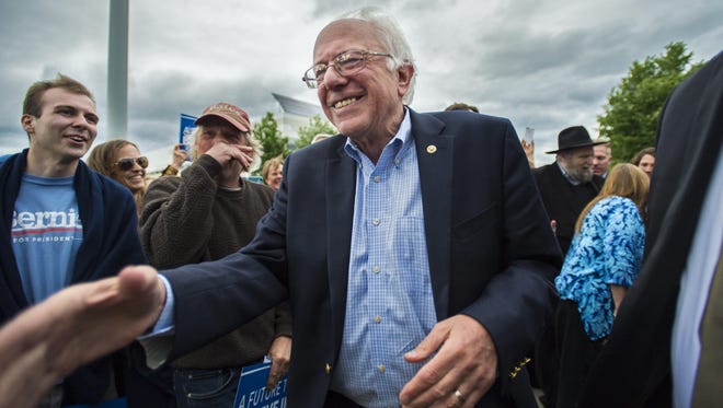 Democratic presidential candidate Vermont Sen. Bernie Sanders greets supporters at the Burlington International Airport in South Burlington on Wednesday, June 8, 2016.