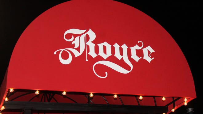 A vivid red canopy creates a signature entrance for Royce, a new wine bar on Ridge Street.