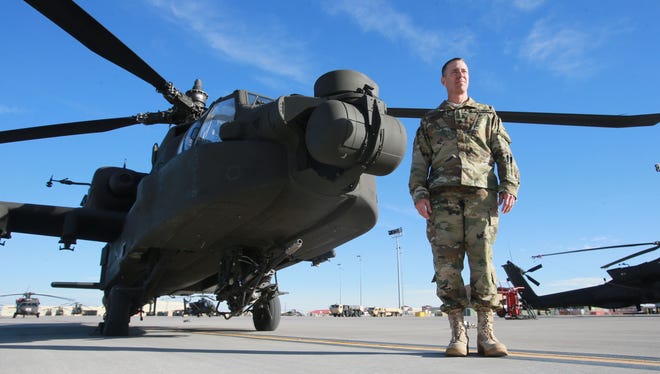 The 1st Battalion, 501st Aviation Regiment is an attack-reconnaissance helicopter battalion. Lt. Col. Chris Crotzer, commander of the unit, stands next to a helicopter.