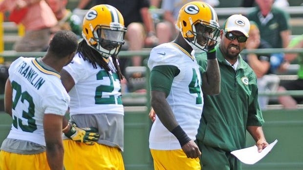 Green Bay Packers running backs coach Sam Gash with Johnathan Franklin, Eddie Lacy, center, and James Starks during OTA practice at Ray Nitschke Field on Tuesday, June 10, 2014.