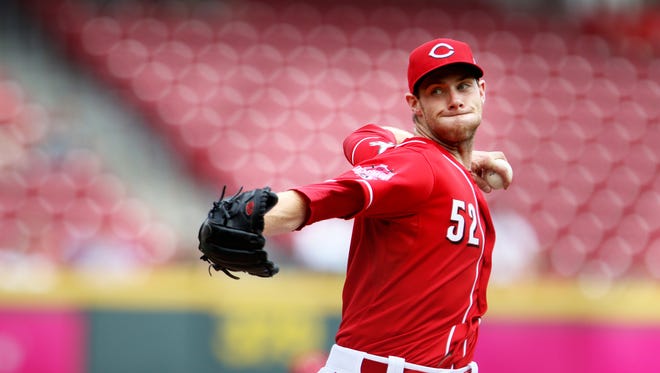 Reds relief pitcher Tony Cingrani pitches in the 9th inning Wednesday against the Rockies.