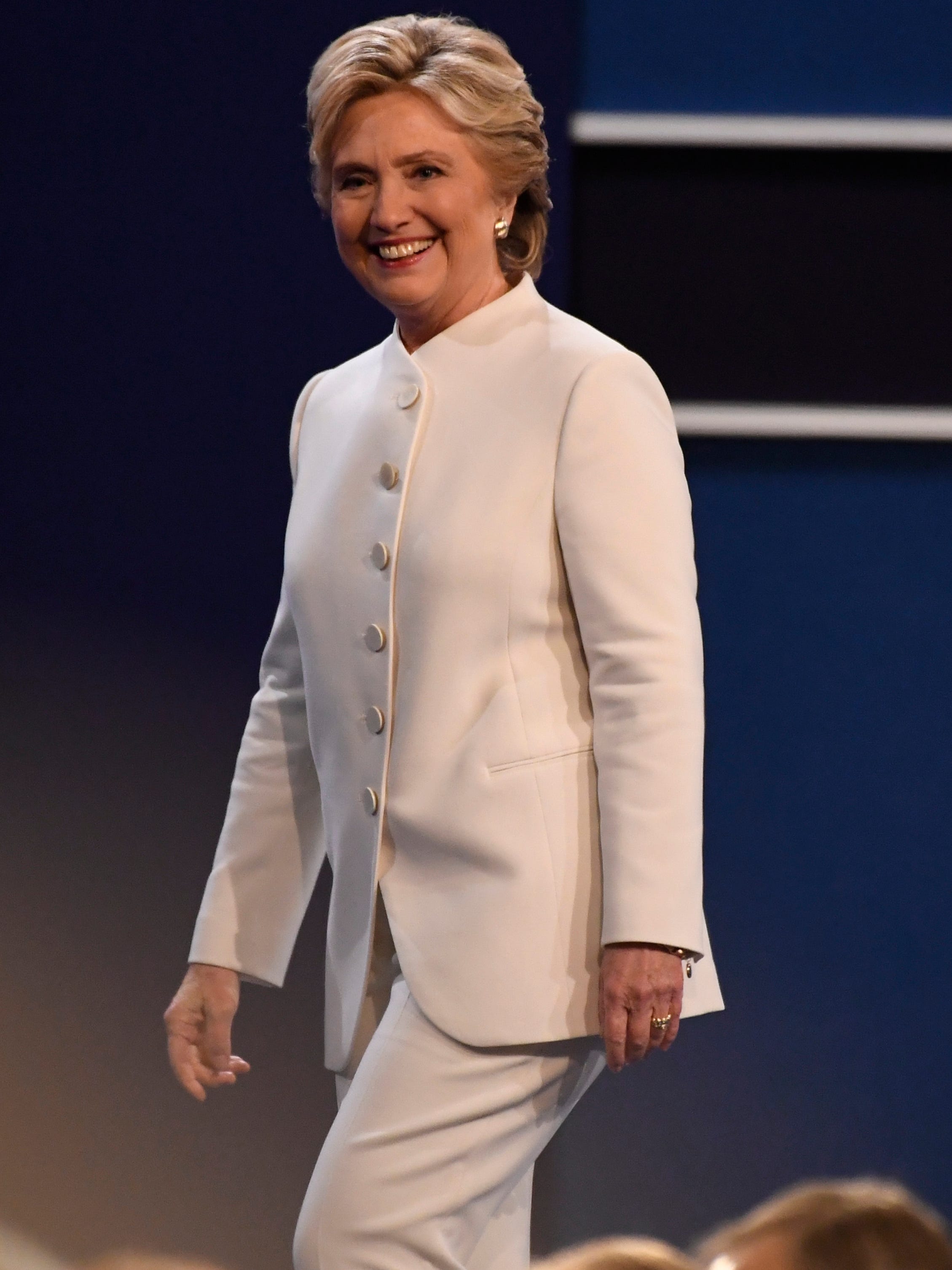 In a conciliatory purple, Hillary Clinton cements status as a pantsuit and  feminist icon