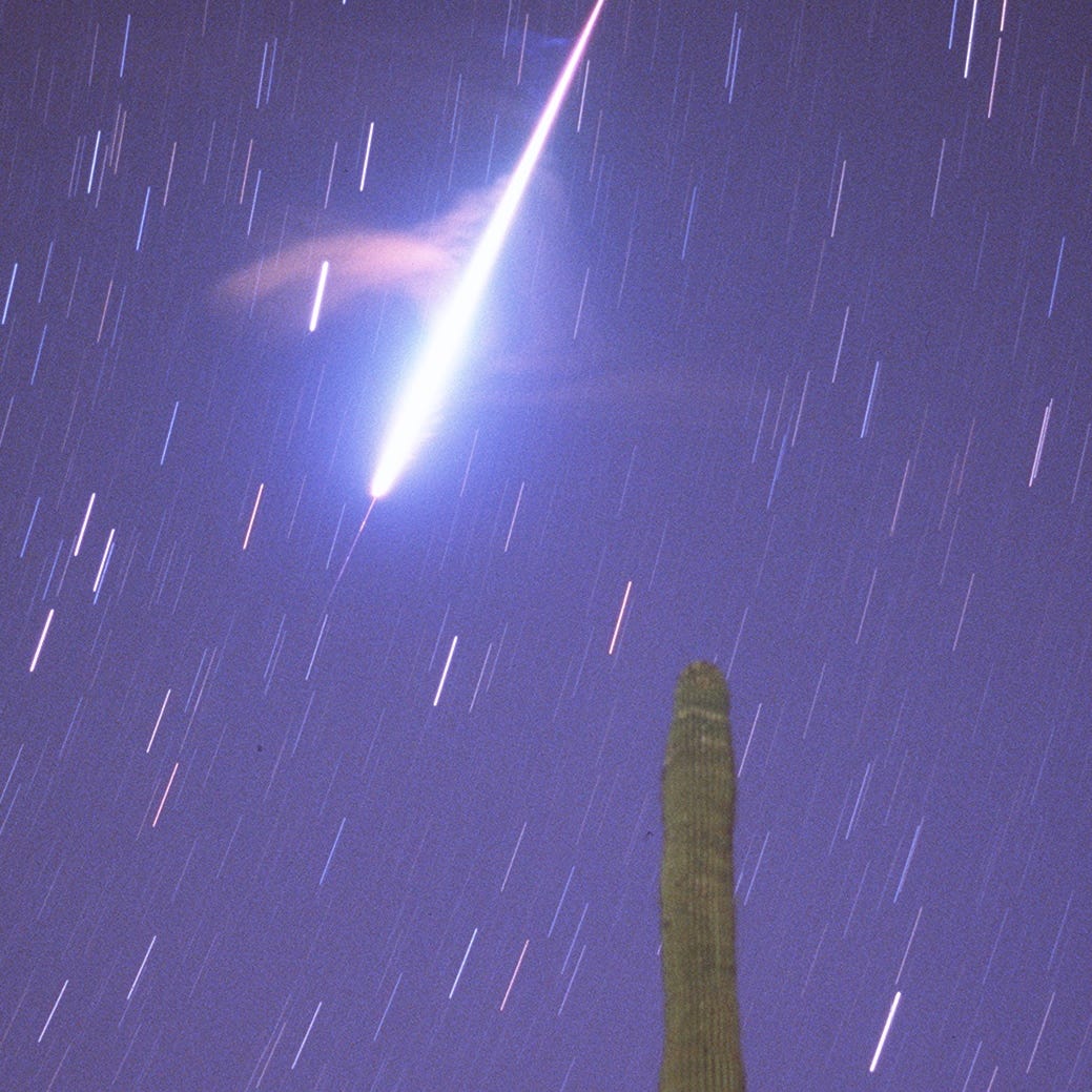 A Leonid meteor burns up as it enters the upper atmosphere in the early morning hours in of Nov. 17, 1998.  The 10-minute exposure also shows the smoke train as it disperses from around the meteor.  The photograph was taken at the Lost Dutchman State Park east of Phoenix.