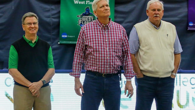 Members of the first UWF men's basketball team, from the 1967-68 season, from left to right, Jody Skelton, Holt Browning, and Tommy Lee, are honored during a Gulf South Conference Tournament game at the University of West Florida Field House on Tuesday, Feb. 27, 2018.
