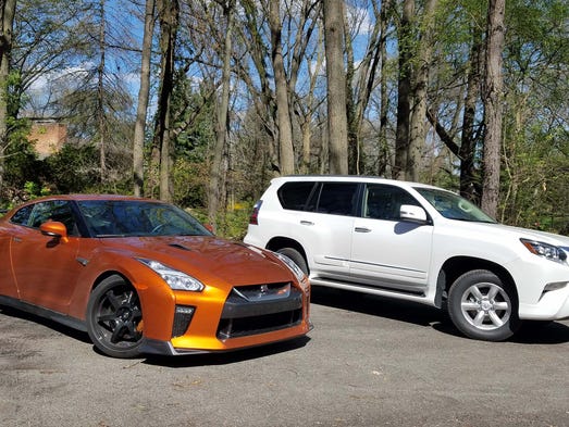 Driveway dinosaurs. The Nissan GT-R supercar, left,