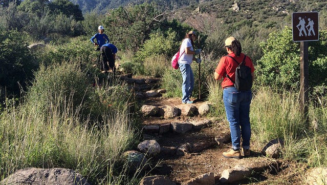 Volunteers help maintain a popular hiking trail in the Organ Mountains.