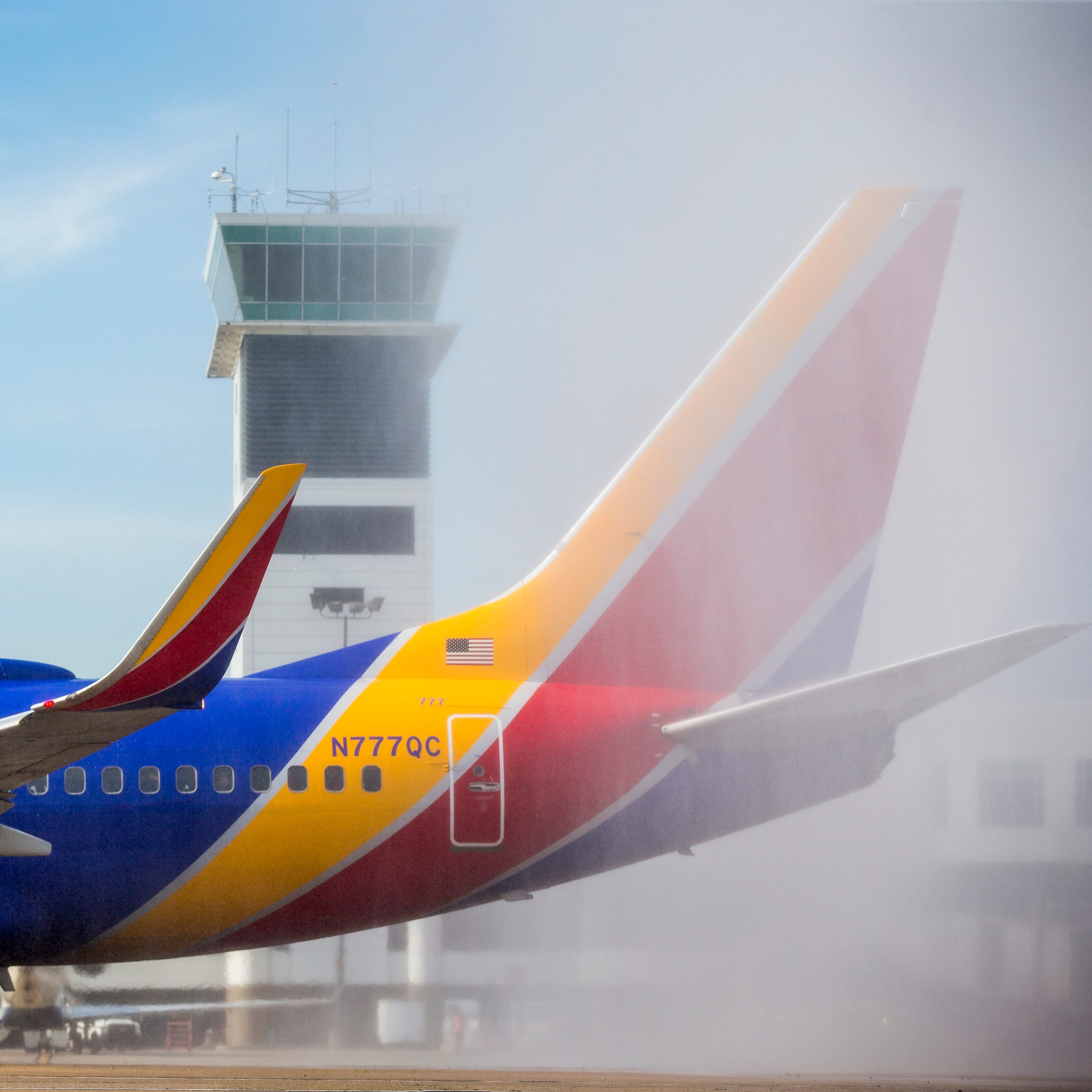 The CVG fire department sprays water over the first Southwest plane to take off from Cincinnati/Northern Kentucky International Airport Sunday, June 4, 2017.