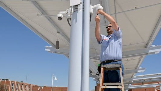 Garry Hunt, with Dyck Security, checks on some of the cameras Monday, May 23, at the Blue Water Transit Bus Center in Port Huron.