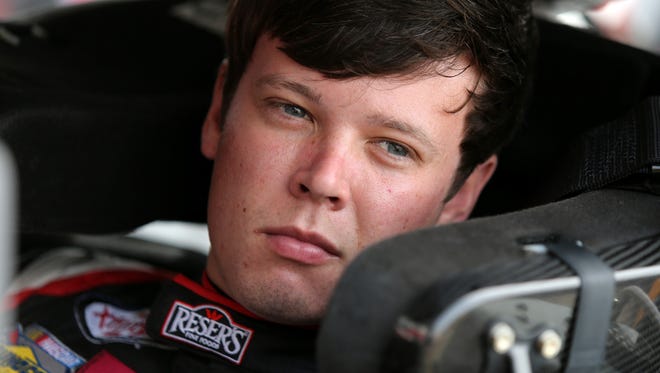 Erik Jones, driver of the #20 Reser's Fine Foods Toyota, sits in his car during practice for the NASCAR XFINITY Series Menards 250 at Michigan International Speedway on June 10, 2016 in Brooklyn, Michigan.  (Photo by Jerry Markland/Getty Images )