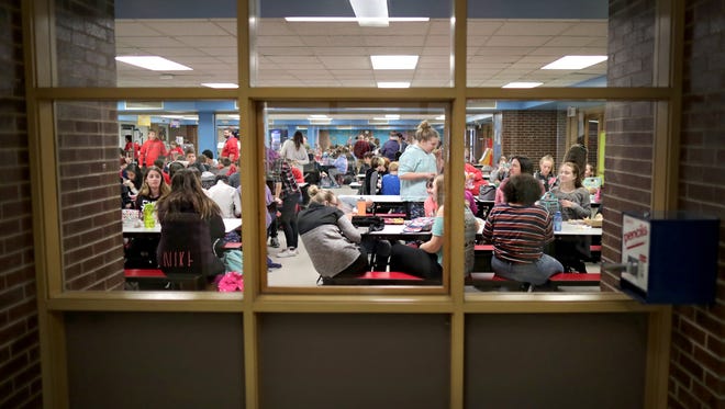 Students take a lunch break in the cafeteria at Shattuck Middle School in Neenah. Voters will determine the fate of the Neenah Joint School District's plan to build a replacement for the school in April.