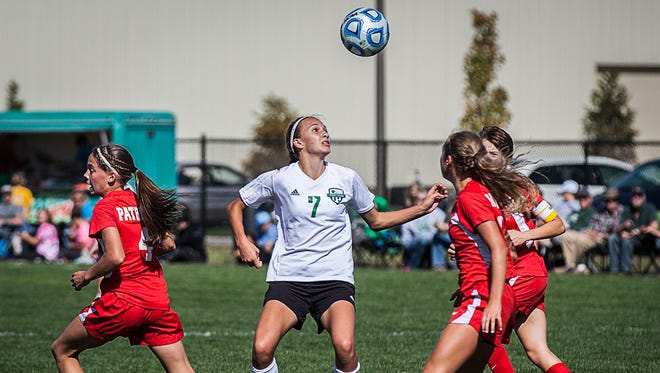 Yorktown's Hannah Rapp fights for possession against Jay County's defense during their game at the Yorktown Sports Park on Saturday, Oct. 10, 2015. 