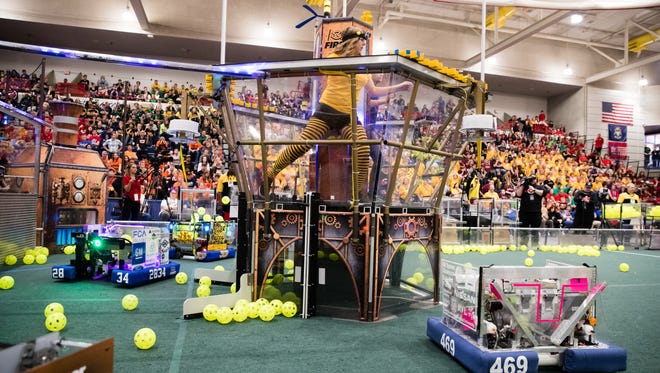 Mary Riss, 18 competes with the Killer Bees of Notre Dame Preparatory School in Pontiac 2017 Michigan FIRST Robotics Competition State Championship at Saginaw Valley State University.
