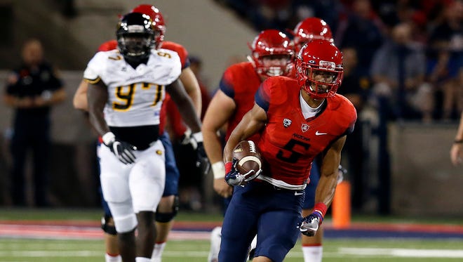 Arizona wide receiver Trey Griffey (5) runs after the catch against Grambling State during the first half of an NCAA college football game, Saturday, Sept. 10, 2016, in Tucson, Ariz.