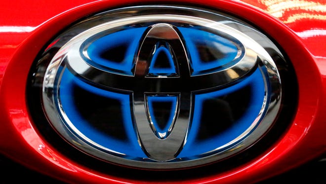 This Feb. 15, 2018, file photo shows the Toyota logo on the trunk of a 2018 Toyota Prius on display at the Pittsburgh Auto Show.