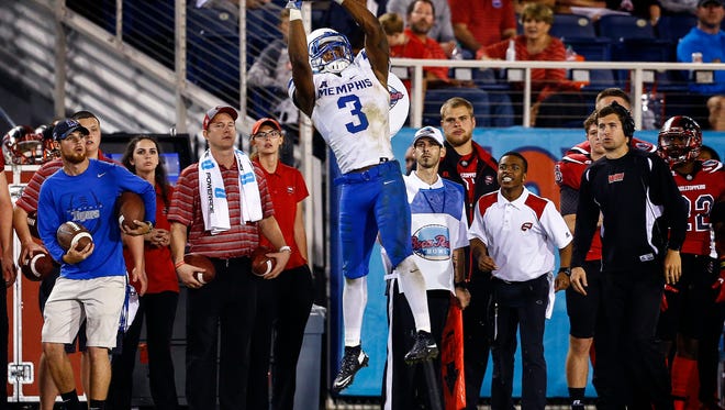 University of Memphis receiver Anthony Miller hauls in a first down catch against the Western Kentucky University defense during fourth quarter action in the Boca Raton Bowl in Florida on Dec. 20, 2016.