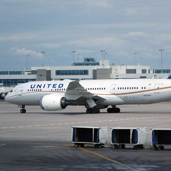 A Boing 787 Dreamliner flown by United Airlines taxis toward a gate at Denver International Airport on March 8, 2016.