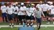 Michigan defensive coordinator Don Brown works with