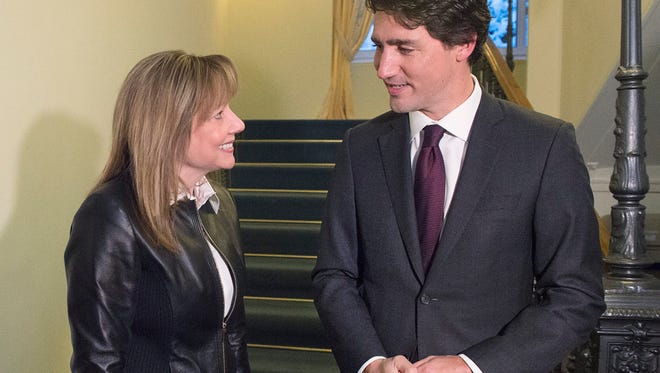 Canada's Prime Minister Justin Trudeau talks with Mary Barra, CEO of General Motors, during a meeting in Davos, Switzerland earlier this year. GM of Canada plans to announce Friday that it will hire 1,000 engineers.