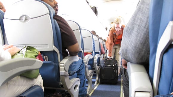 Passengers board a Delta Airlines flight.