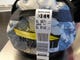 A bag gets tagged at check-in witha traditional label