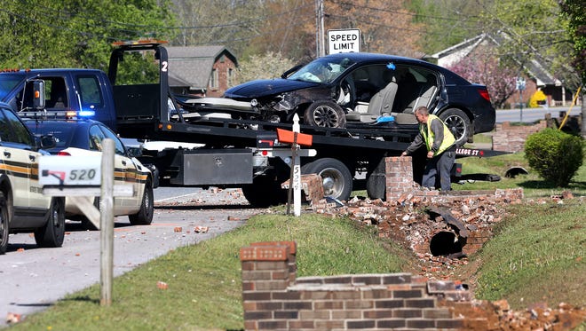 An accident scene is cleared ,Tuesday, April 12, 2016, on Warrior Drive near Riverdale High School following a high speed chase resulting in a crash.