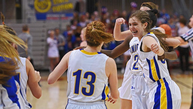 O'Gorman players, indluding Rylee Benson (5) and Ashlee Beacom (13), celebrate their 47-34 win over Aberdeen Central in a 2017 SDHSAA Class AA State Girls Basketball semifinal game Friday, March 17, 2017, at Rushmore Plaza Civic Center in Rapid City. O'Gorman beat Aberdeen Central 47-34, and will play in Saturday's final. 