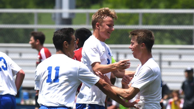 Lee High players celebrate a goal by Kyle Stenzel (right) in the first half. Lee beat George Mason 3-0 in the Region 2B boys soccer championship game Friday afternoon.