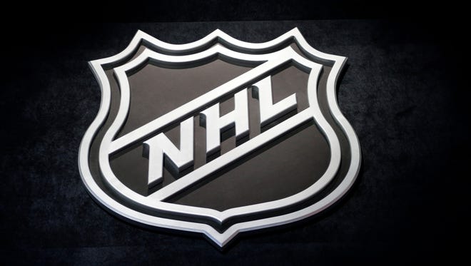 An NHL logo is shown before the start of the first round of the NHL hockey draft, Friday, June 26, 2015 in Sunrise, Fla.
