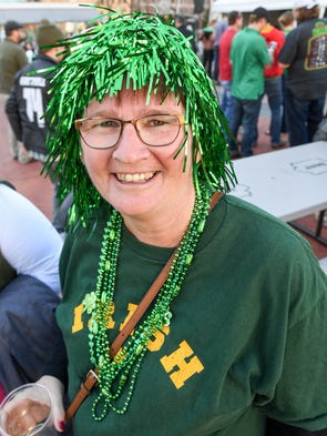 Jane Brown of Granger models her green wig on Friday,