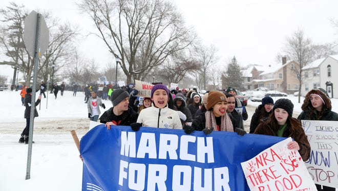 City High and West High students lead a large group from College Green Park to the Pentacrest for the March For Our Lives protest on Saturday, March 24, 2018 in Iowa City, Iowa. 