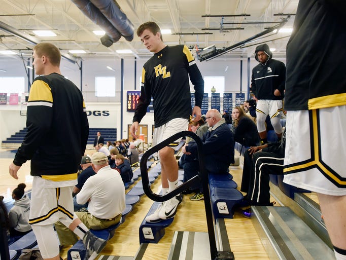 The Red Lion basketball team leaves the stands to prepare