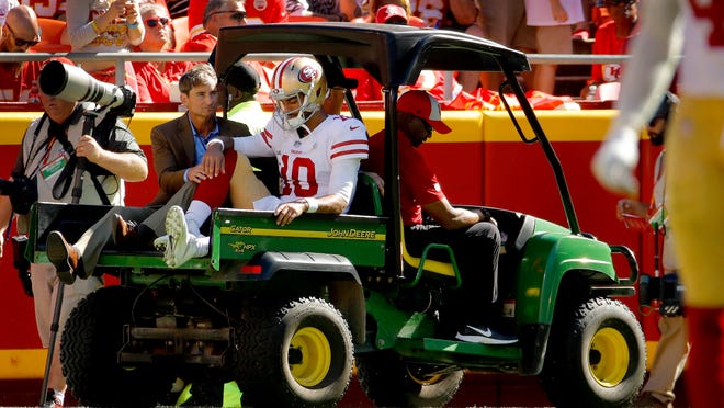 San Francisco 49ers quarterback Jimmy Garoppolo (10) is carted off the field after being injured during the second half of an NFL football game against the Kansas City Chiefs, Sunday, Sept. 23, 2018, in Kansas City, Mo. (AP Photo/Charlie Riedel)