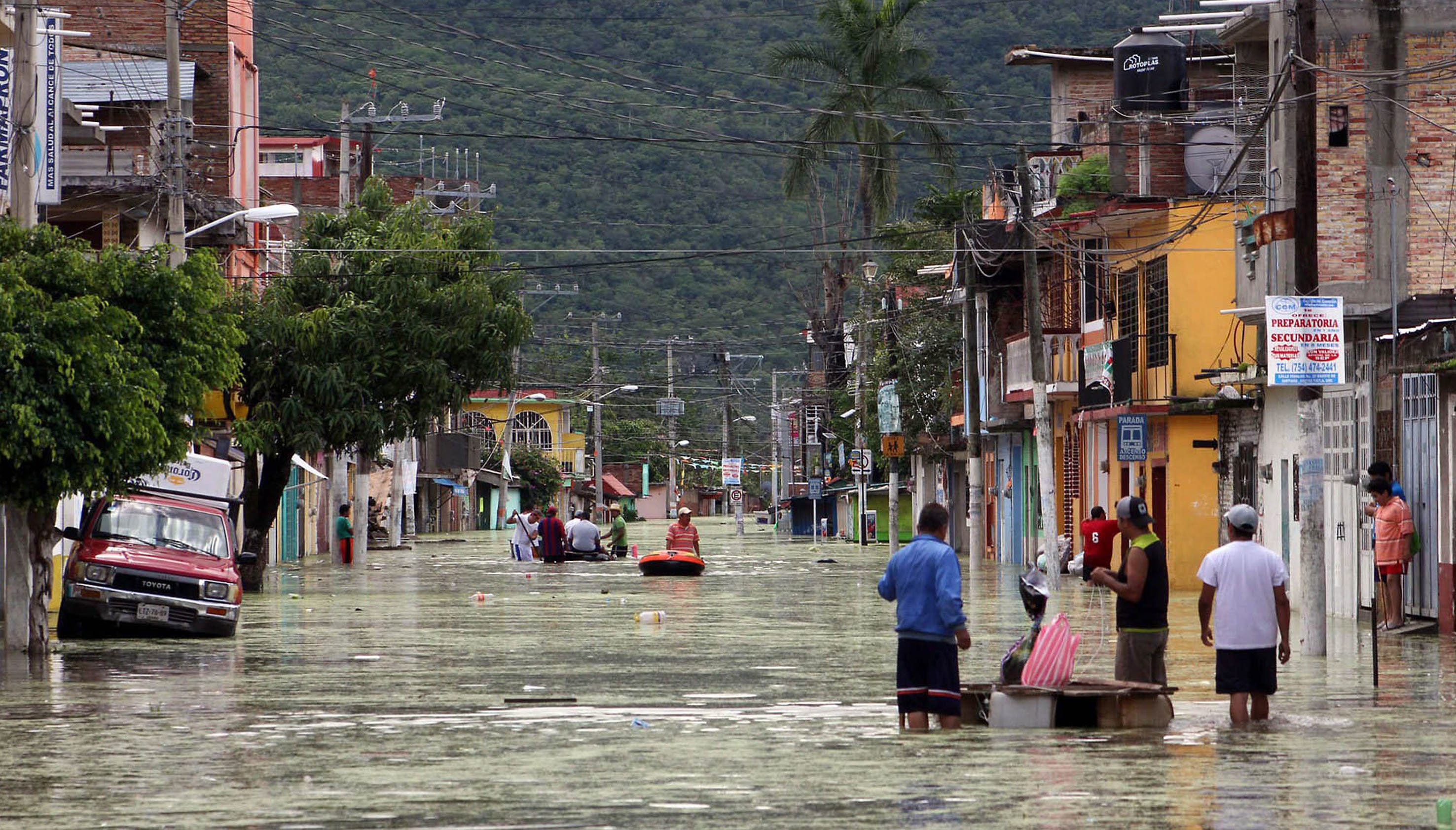 Tropical storm, hurricane slam Mexico