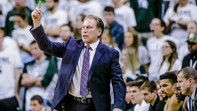Matt McQuaid, fifth from right, sits on Michigan State's bench behind coach Tom Izzo on Saturday. McQuaid missed the Spartans' 71-63 win over Tennessee Tech with a head injury.